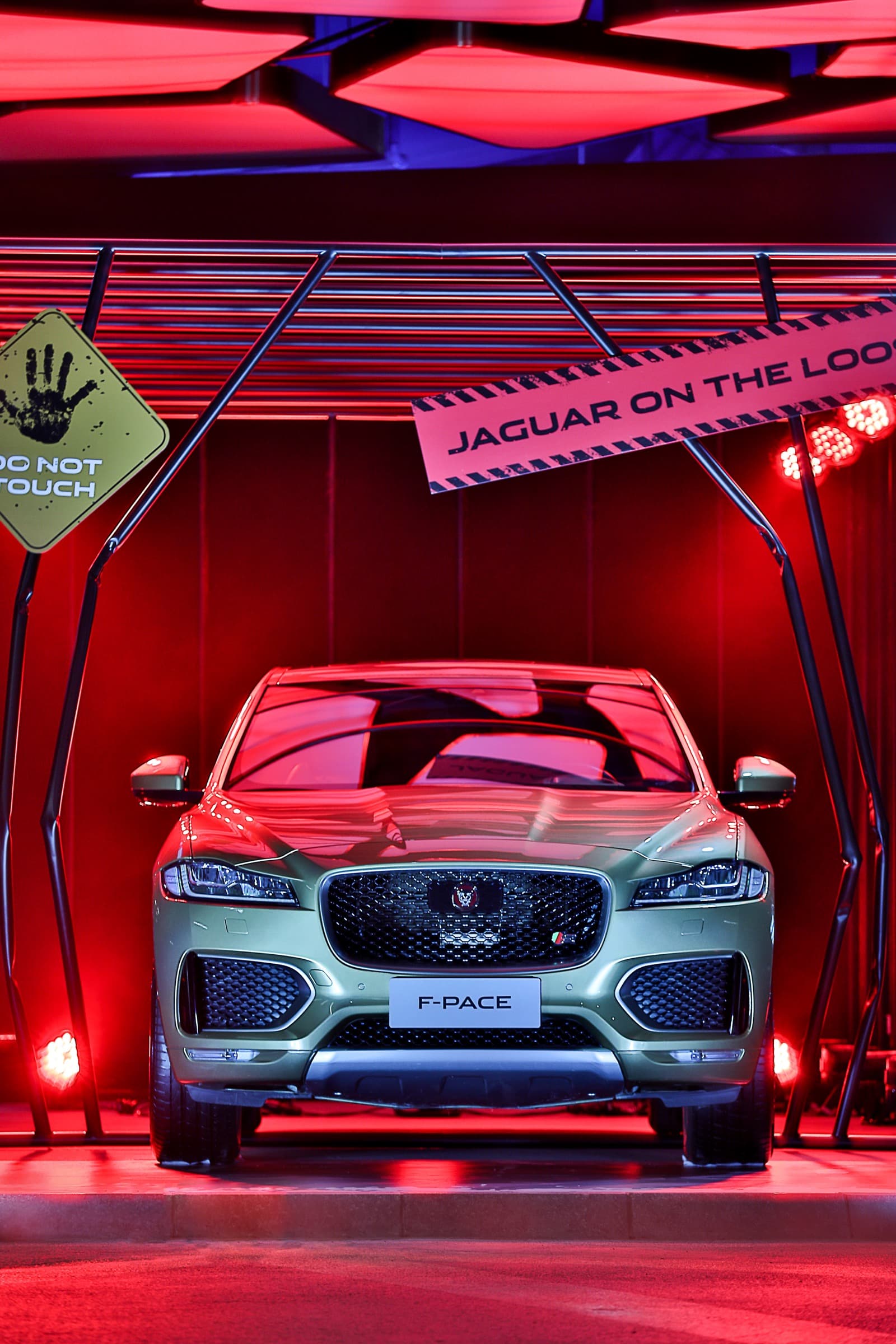 F-PACE driving through red tunnel